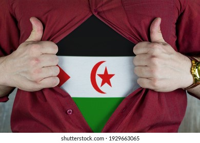 Young Sport Fan Opening His Shirt And Showing The Flag West Sahara