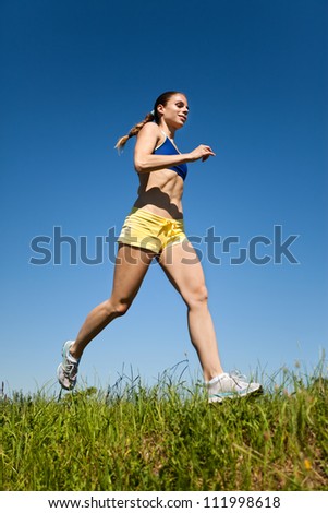 Young sport fitness woman running
