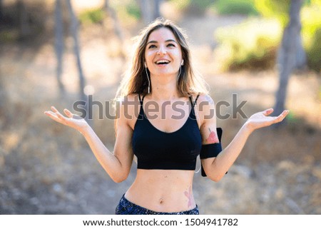 Young sport girl at outdoors smiling a lot