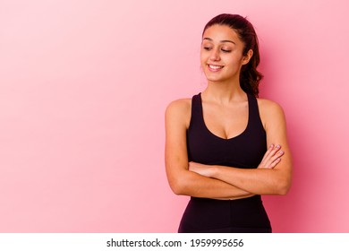 Young sport Indian woman isolated on pink background smiling confident with crossed arms. - Powered by Shutterstock