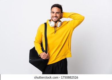 Young Sport Man With Sport Bag Isolated On White Background Laughing