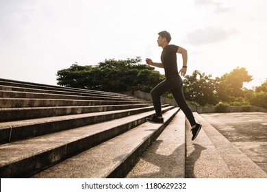 Young sport man running upstairs on city stairs  - Powered by Shutterstock