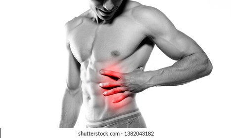 young sport man with strong athletic body with Injury of the rib. isolated on white background.