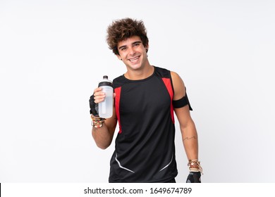 Young Sport Man With Tattoos Over Isolated White Background With Sports Water Bottle