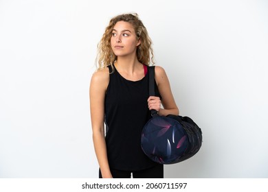 Young Sport Woman With Sport Bag Isolated On White Background Looking To The Side