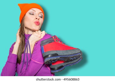 Young Sport Woman Holding Hiking Boots, Active Healthy Lifestyle Concept, Focus On Lips And Boots