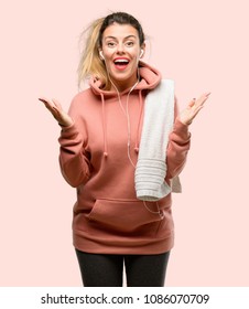 Young Sport Woman Wearing Workout Sweatshirt Happy And Surprised Cheering Expressing Wow Gesture