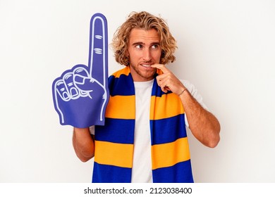 Young Sports Caucasian Fan Man Isolated On White Background Biting Fingernails, Nervous And Very Anxious.