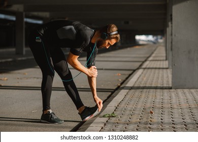 Young Sports Man Stretching Outdoors