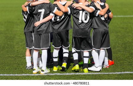 Young Sports Team. The Sport Football Team With Coach; Group Photo; Kids With Soccer Coach Gathering Before Match. Youth Soccer Football Team. 