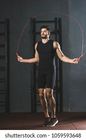 Young Sportsman Doing Jump Rope Workout In Gym