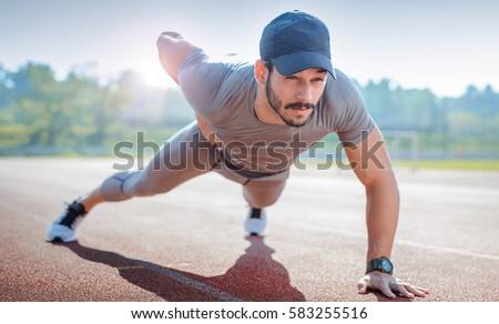 Similar – Jogger stretching in the morning on seaside.