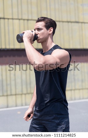 Image, Stock Photo Young sportsman drinking water after jogging