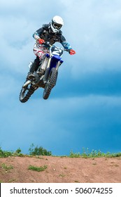 The Young Sportsman On A Motorcycle Jump