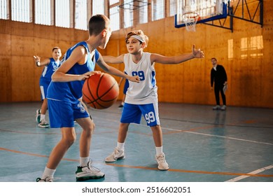 Young sportsperson with jersey number 99 handling a basketball with intent during a match, symbolizing active youth sports - Powered by Shutterstock