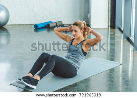 Similar – Image, Stock Photo young woman foam rolling after exercise in gym