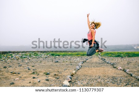 Similar – Junge Sportlerin beim Springen auf die Straße