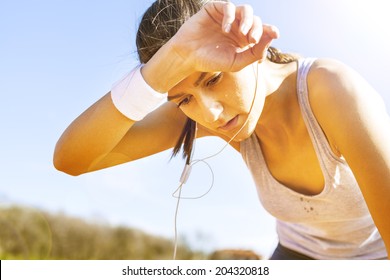 Young sportswoman resting after running. - Powered by Shutterstock