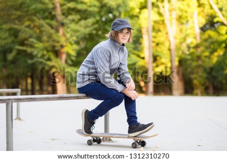 Similar – teenager practicing with skateboard at sunrise city