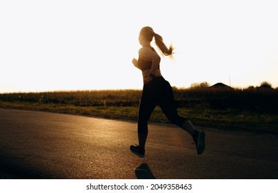 Young Sporty Girl Running On Road Stock Photo 2049358463 