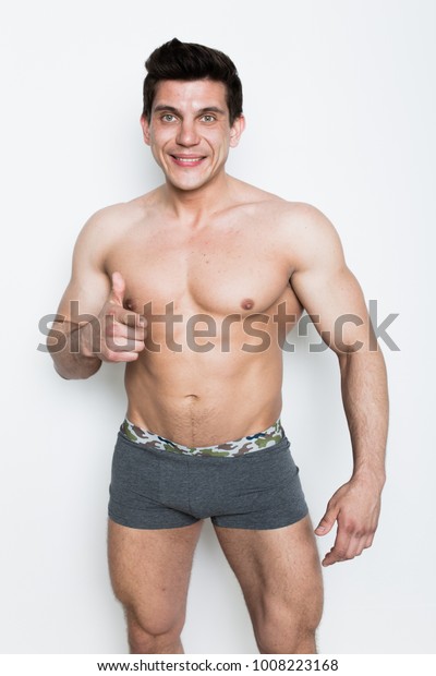 Young Sporty Man Shows Slim Figure Stock Photo Edit Now 1008223168