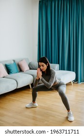 Young Sporty Woman Doing Squat Morning Exercise. Home Fitness Routine. Woman With Strong Glutes Workout At Home. Female Gymnastics. Butt Workout Motivation.