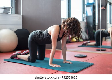 Young sporty woman in gym