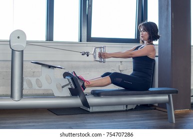 
Young sporty woman in gym