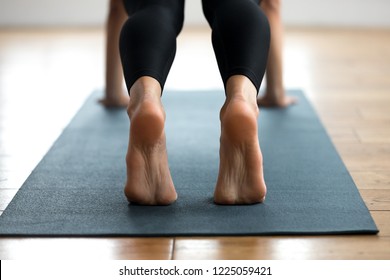 Young Sporty Woman Practicing Yoga, Doing Push Ups Press Ups Exercise, Phalankasana, Plank Pose, Working Out, Wearing Sportswear, Indoor Close Up, Yoga Studio. Foot And Heel Care, Well Being Concept