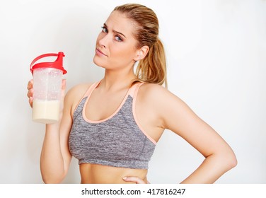 Young Sporty Woman With Protein Shake Bottle