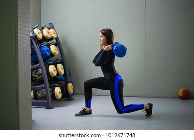 Young sporty woman working out with fitness bag at gym, lunges exercise - Powered by Shutterstock