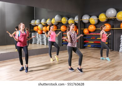 Young Sporty Women Training In Gym