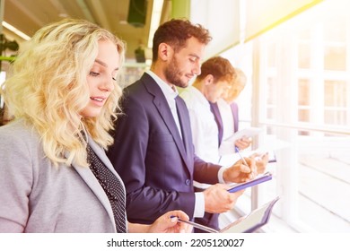 Young Start-up Business Team Having Orientation In The Office With Clipboard And Files