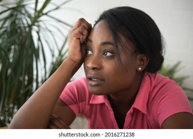 Young Stressed Depressed Black African Lesbian Woman Sitting At Her Home Feeling Miserable And Anxious After She Been Lonely And Abandoned From Her Family And Friends