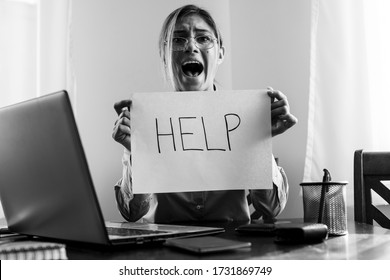 Young stressed and depressed business woman working overwhelmed and exhausted as corporate company employee asking for help desperate and frustrated in job problem and crisis concept. Business concept