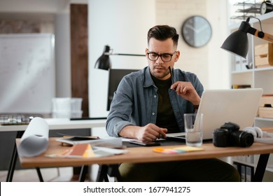 Young Stressed Handsome Businessman Working In Office. Angry Businessman With Too Much Work In Office. 