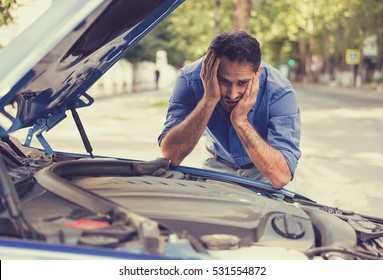 Young Stressed Man Having Trouble With His Broken Car Looking In Frustration At Failed Engine