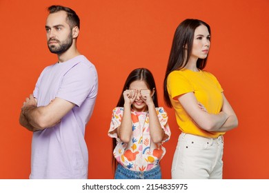 Young Strict Angry Serious Parents Mom Dad With Sad Crying Child Kid Daughter Teen Girl Wearing Basic T-shirts Isolated On Yellow Background Studio Portrait. Family Day Parenthood Childhood Concept.