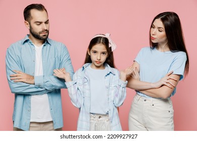 Young Strict Parents Mom Dad With Child Kid Daughter Teen Girl In Blue Clothes Spread Hands Like Nothing To Say Isolated On Plain Pastel Light Pink Background. Family Day Parenthood Childhood Concept