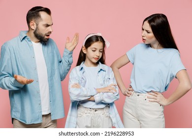 Young Strict Sad Angry Indingnant Parents Mom Dad With Child Kid Daughter Teen Girl In Blue Clothes Scold Kid Isolated On Plain Pastel Light Pink Background. Family Day Parenthood Childhood Concept