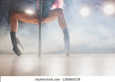 Young Striptease Dancer Moving In High Heels Shoes On Stage In Strip Night Club, Pole Dancing.