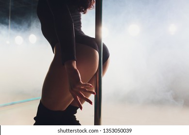 Young Striptease Dancer Moving In High Heels Shoes On Stage In Strip Night Club, Pole Dancing.