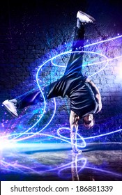 Young Strong Man Break Dance. With Light Effects.