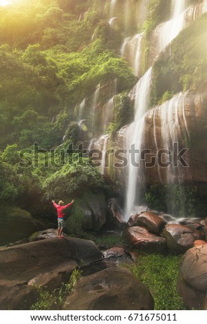 Young strong man traveler enjoy spectacular morning view