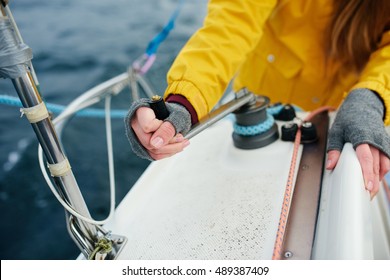 Young Strong Woman Sailing The Boat