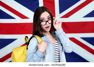 Young student with backpack on British flag background