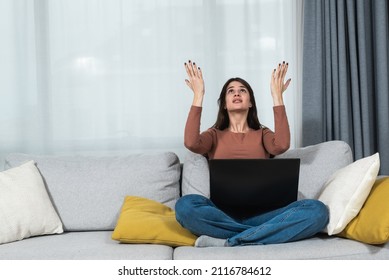 Young Student Or Business Woman Sitting At Home Covering Her Ears With Hands Because She Cant Study Or Work On Her Laptop Computer From Loud Noise Coming From Apartment Above. 