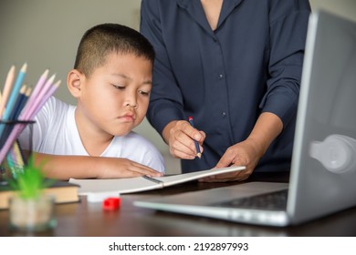 Young Student Distance Learning Virtual Distance Online Class On Video Call Virtual Lesson With Mother, Studying At Home Using Laptop Computer. Parent Or Tutor Teaching Child Boy With Remote Education