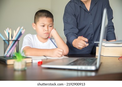 Young Student Distance Learning Virtual Distance Online Class On Video Call Virtual Lesson With Mother, Studying At Home Using Laptop Computer. Parent Or Tutor Teaching Child Boy With Remote Education