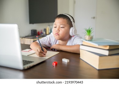 Young Student Distance Learning Virtual Distance Online Class On Video Call Virtual Lesson, Technology Studying At Home Using Laptop Computer. Parent Or Tutor Teaching Child Boy With Remote Education.